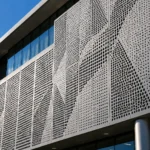 Modern aluminium perforated façade system on a commercial building with custom architectural perforation patterns.